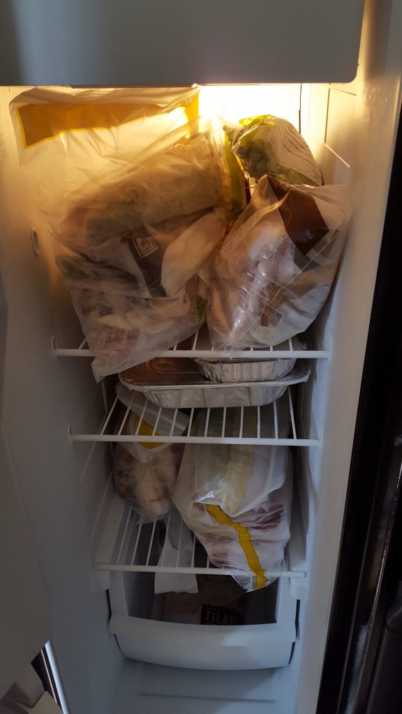 My freezer at home stuffed full of meals for the month